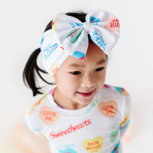 Baby Kids Bamboo Pajamas — Sweethearts® Colorful Candy Hearts Biggie Bow — Image 1