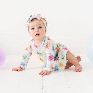 Baby Kids Bamboo Pajamas — Sweethearts® Colorful Candy Hearts Ruffle Dress — Image 1