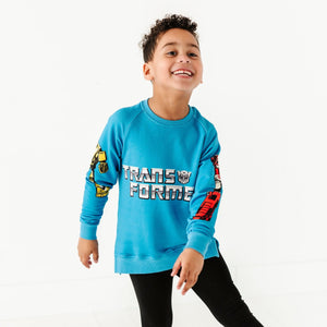 Baby Kids Bamboo Pajamas — Crew Neck Sweatshirt Transformers™ Autobots & Decepticons — Image 1