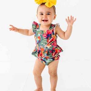 Baby Kids Bamboo Pajamas — Parrot-ise Found Peplum One Piece Swimsuit — Image 1