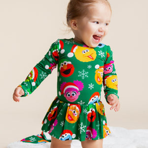 Baby Kids Bamboo Pajamas — Sesame Street™ Holiday Cheer Long Sleeve Ruffle Dress — Image 1
