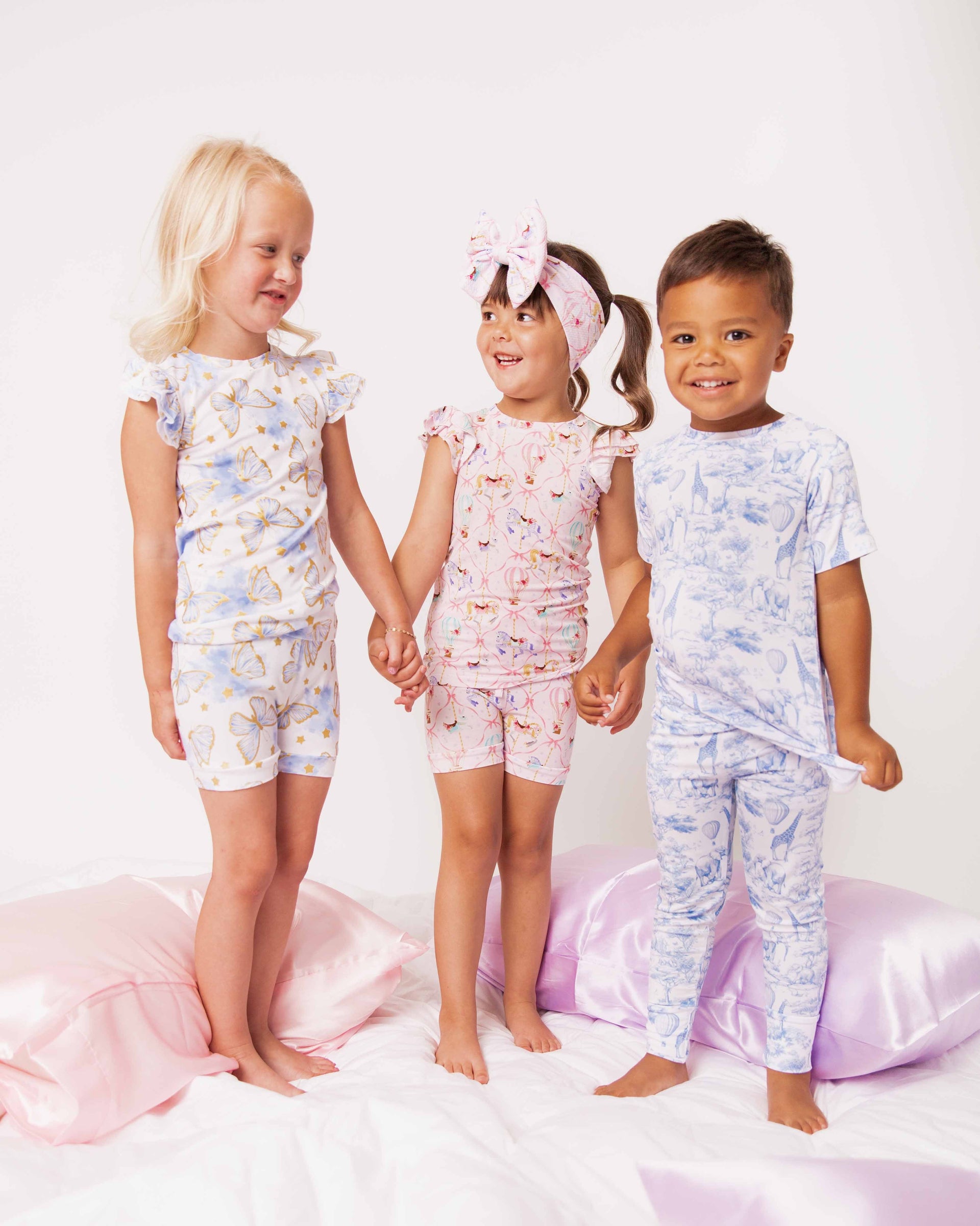 Bamboo short-sleeve pajama sets worn by 3 toddler models