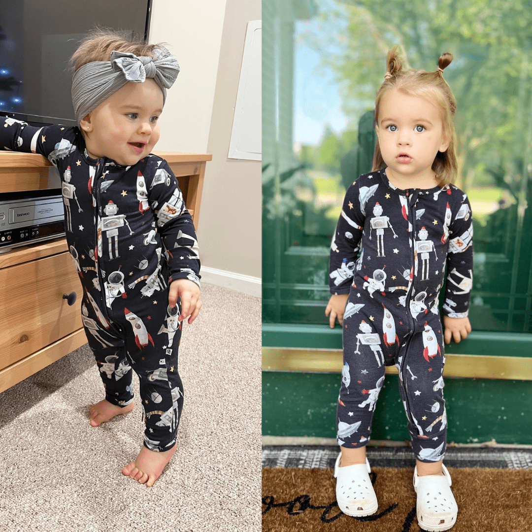 Two toddlers in matching navy space-print bamboo pajamas; one indoors and one at a door, electronics label 'DAEWOO' visible.