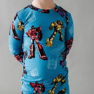 Two-Piece Pajama Set Transformers™ Autobots & Decepticons - Image 1 - Bums & Roses