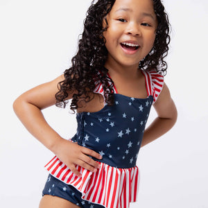 Baby Kids Bamboo Pajamas — Star of the Show Peplum One Piece Swimsuit — Image 1