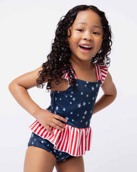 Baby Kids Bamboo Pajamas — Star of the Show Peplum One Piece Swimsuit — Image 1