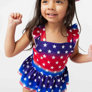 Baby Kids Bamboo Pajamas — Stars Aligned Peplum One Piece Swimsuit — Image 1