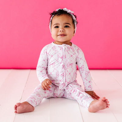 Bums & Roses - Baby & Kids Bamboo Pajamas - Take A Bow Convertible Ruffle Romper - Image 1