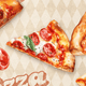 Slices of pepperoni pizza with cheese and basil on a patterned background