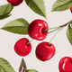 Pattern of red cherries with green leaves on a light background