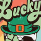 The word 'Lucky' in green with a leprechaun hat and shamrock.