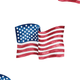 Two American flags waving, symbolizing patriotism and celebration.