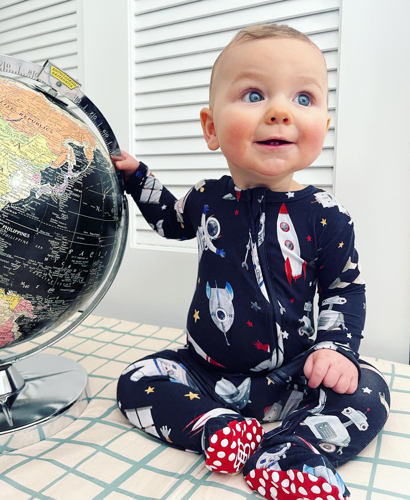 Space footie pajamas top