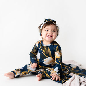 Bums & Roses - Baby & Kids Bamboo Pajamas - Read My Tulips Ruffle Romper - Image 1